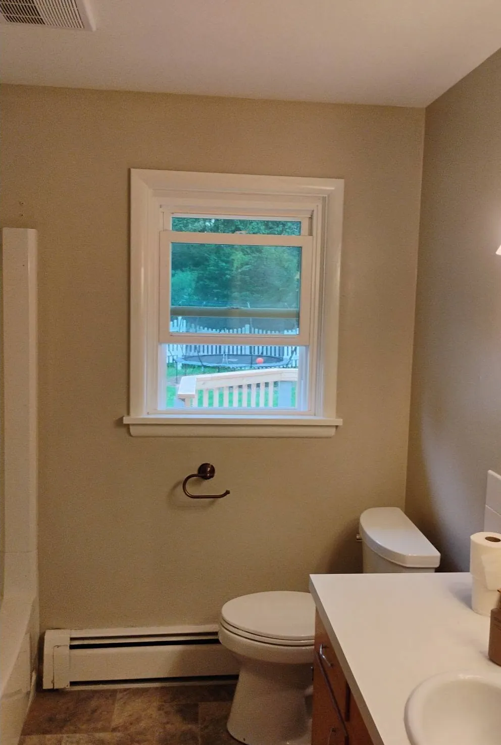 Bathroom before, painted a warm neutral with white trim